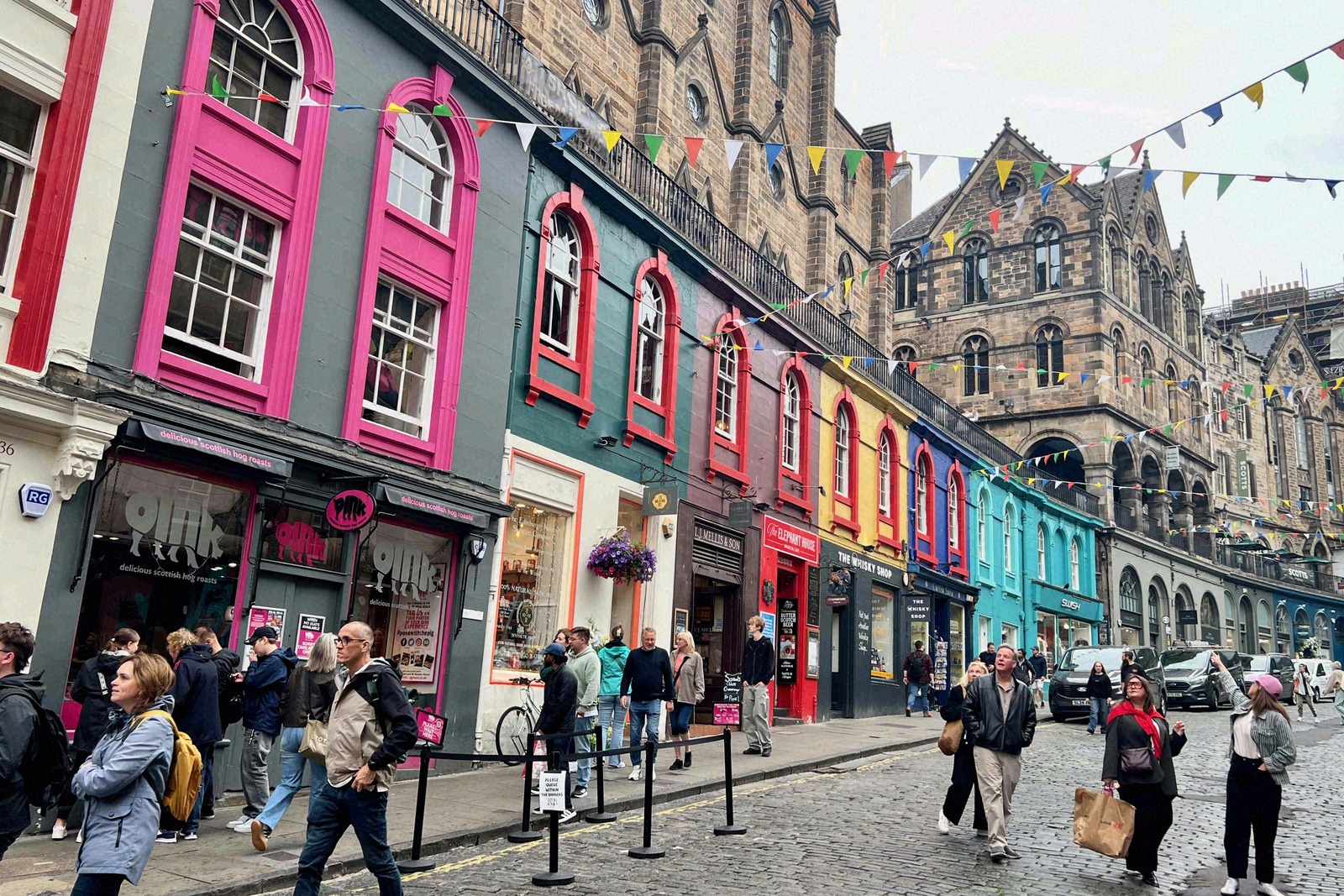 Visitors on the cobbles of Victoria Street in Edinburgh's Old Town