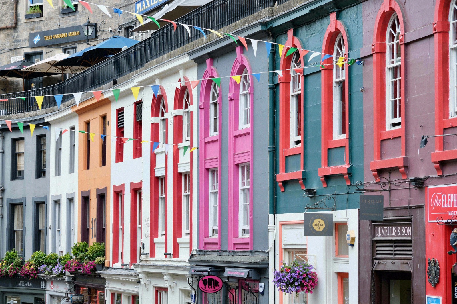 Colourful shopfronts and bunting on Victoria Street in the Old Town